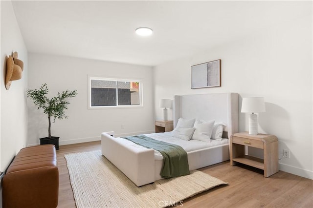 1825 W Carlton Pl, Santa Ana, CA 92704 - bedroom featuring light wood-style floors and baseboards