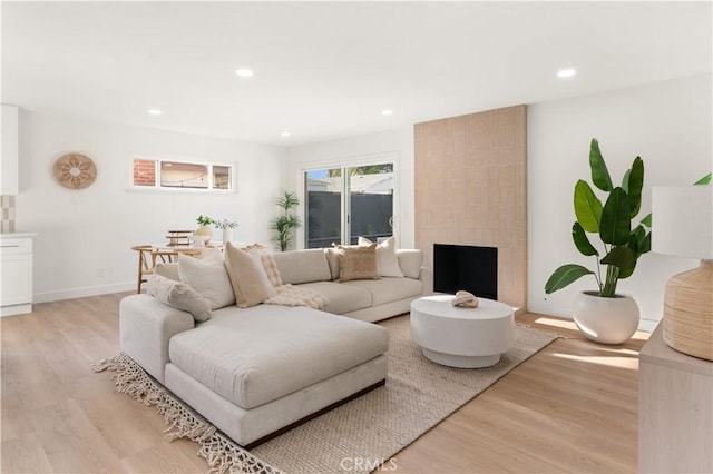 1825 W Carlton Pl, Santa Ana, CA 92704 - living area featuring light wood finished floors and recessed lighting