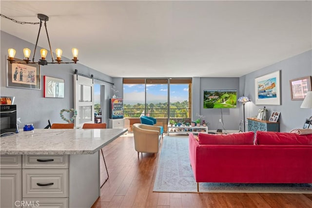 24055 W Paseo Del Lago Unit 962, Laguna Woods, CA 92637 - living area featuring hardwood / wood-style floors and a chandelier