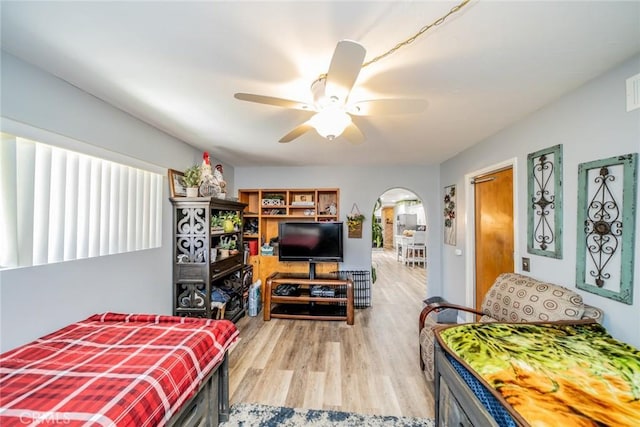 1181 W Westmont Ave, Hemet, CA 92543 - bedroom featuring arched walkways, light wood-type flooring, and ceiling fan