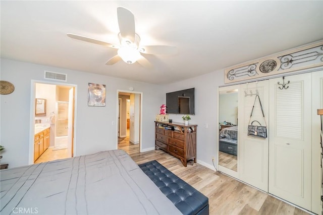 1181 W Westmont Ave, Hemet, CA 92543 - bedroom featuring light wood-type flooring, a closet, ensuite bath, and ceiling fan