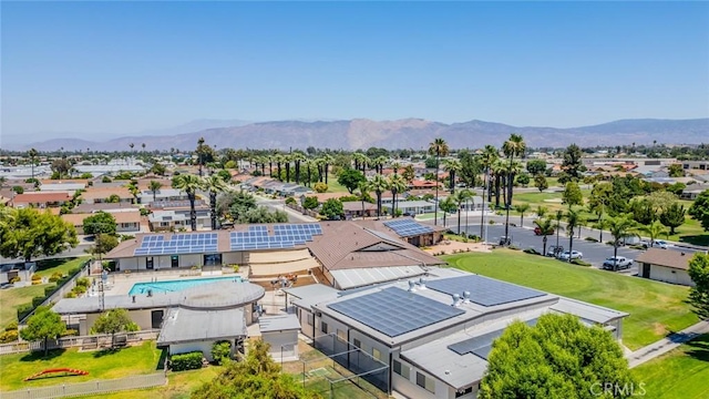 1181 W Westmont Ave, Hemet, CA 92543 - aerial perspective of suburban area featuring a mountainous background and a pool area