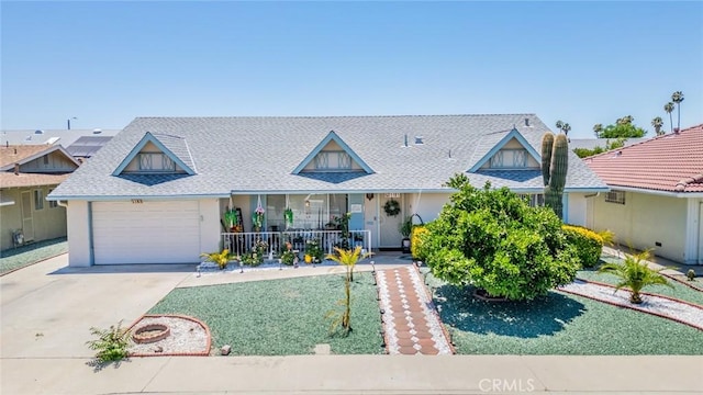 1181 W Westmont Ave, Hemet, CA 92543 - view of front of home with a porch, driveway, a garage, and a shingled roof