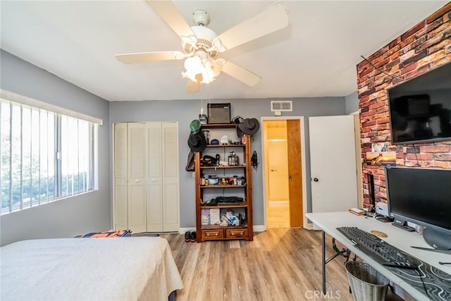 1181 W Westmont Ave, Hemet, CA 92543 - bedroom with light wood-style flooring, a closet, and ceiling fan