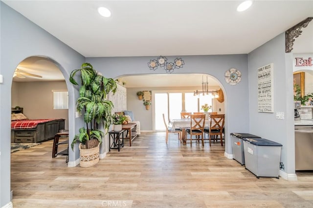 1181 W Westmont Ave, Hemet, CA 92543 - entrance foyer with arched walkways, light wood-style floors, and recessed lighting