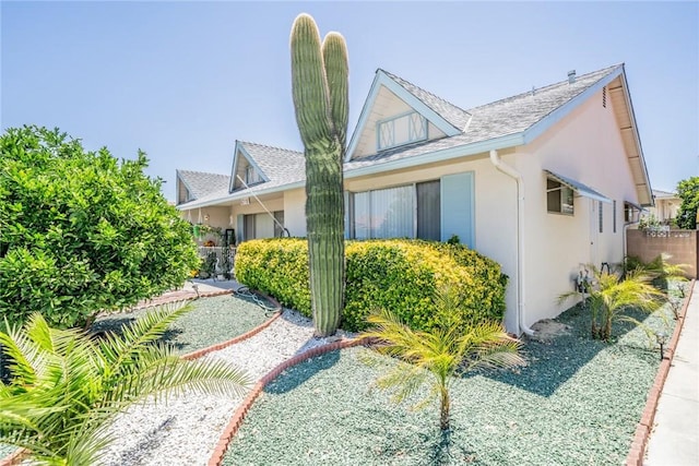 1181 W Westmont Ave, Hemet, CA 92543 - view of side of home with stucco siding and a shingled roof