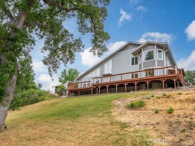15540 China Rpds, Red Bluff, CA 96080 - back of property with a deck and a lawn