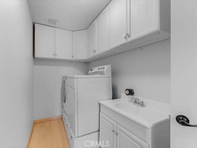 15540 China Rpds, Red Bluff, CA 96080 - washroom with independent washer and dryer, wood finished floors, and cabinet space
