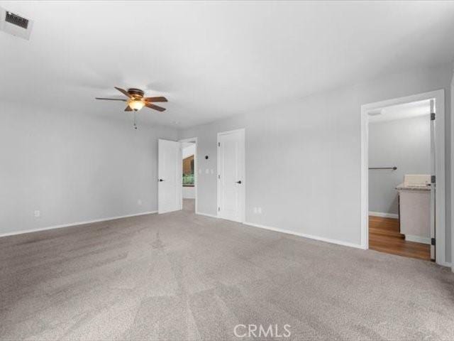 15540 China Rpds, Red Bluff, CA 96080 - unfurnished living room featuring carpet flooring and ceiling fan