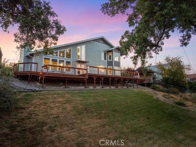 15540 China Rpds, Red Bluff, CA 96080 - back of property at dusk featuring a deck