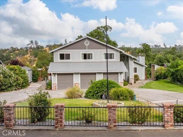 15540 China Rpds, Red Bluff, CA 96080 - traditional-style house featuring driveway, a garage, and a metal roof