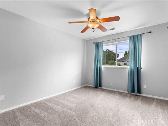 15540 China Rpds, Red Bluff, CA 96080 - empty room featuring ceiling fan and carpet floors