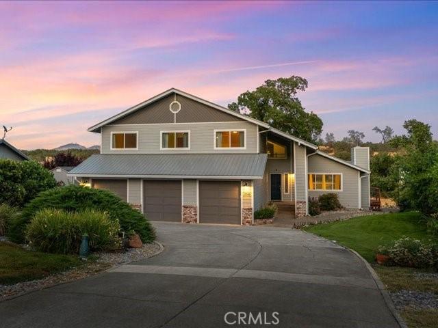 15540 China Rpds, Red Bluff, CA 96080 - view of front of property featuring a garage, driveway, and stone siding