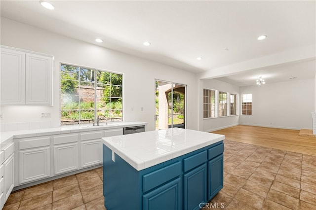 3959 Grandview Dr, Brea, CA 92823 - kitchen featuring white cabinets, open floor plan, recessed lighting, dishwasher, and a center island