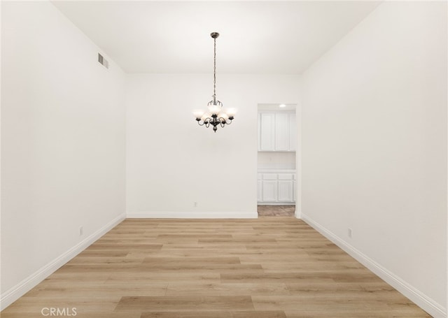 3959 Grandview Dr, Brea, CA 92823 - unfurnished dining area featuring a chandelier and light wood-style flooring