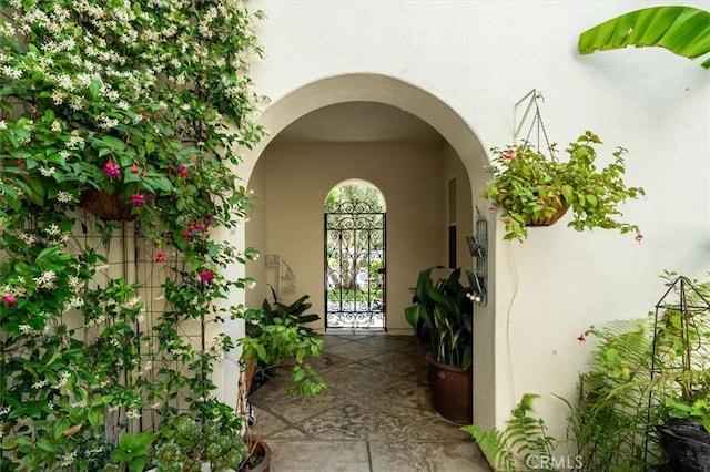 24711 Tiburon St, Valencia, CA 91355 - view of exterior entry featuring stucco siding and a gate
