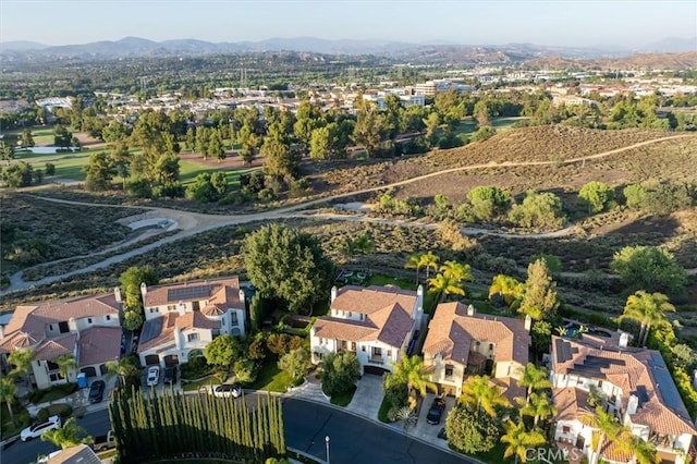 24711 Tiburon St, Valencia, CA 91355 - aerial overview of property's location featuring a mountainous background and nearby suburban area