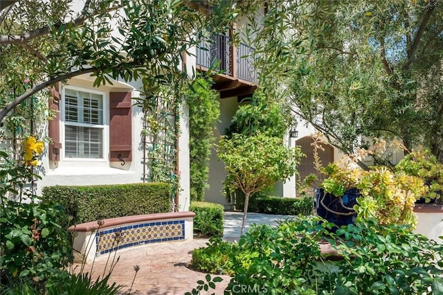 24711 Tiburon St, Valencia, CA 91355 - view of property exterior featuring a balcony and stucco siding