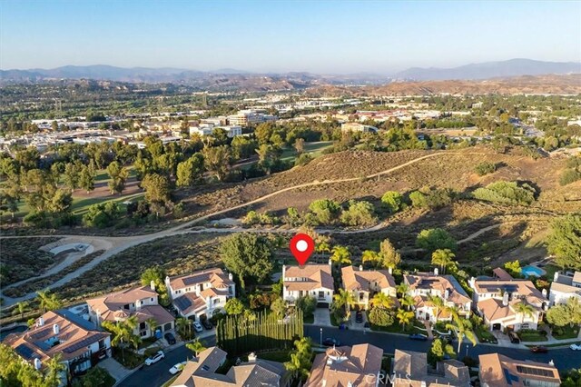 24711 Tiburon St, Valencia, CA 91355 - aerial view of property and surrounding area with a mountain backdrop and nearby suburban area