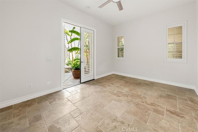 24711 Tiburon St, Valencia, CA 91355 - spare room featuring stone tile floors and a ceiling fan
