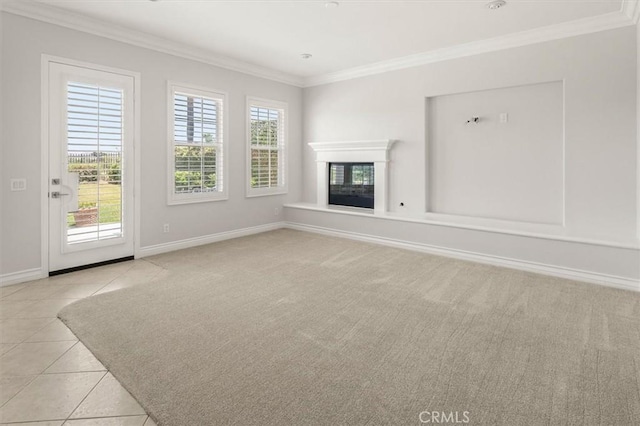 24711 Tiburon St, Valencia, CA 91355 - unfurnished living room with ornamental molding, light tile patterned flooring, a glass covered fireplace, and light carpet