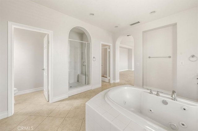 24711 Tiburon St, Valencia, CA 91355 - bathroom with a jetted tub, a stall shower, and tile patterned flooring