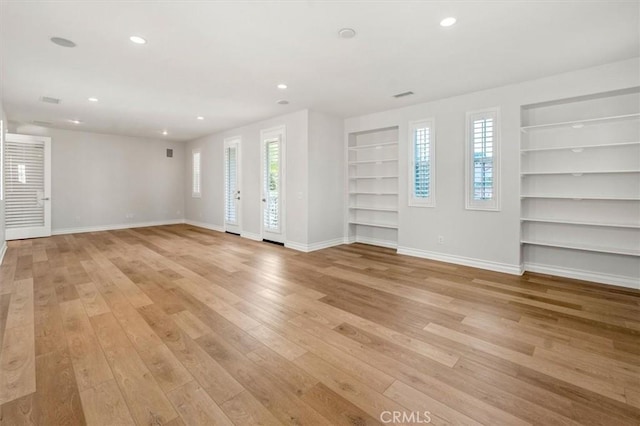 24711 Tiburon St, Valencia, CA 91355 - unfurnished living room featuring built in features, light wood-style floors, recessed lighting, and healthy amount of natural light