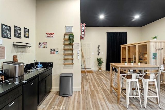 310 Teakwood Dr, Big Bear Lake, CA 92315 - kitchen with dark cabinetry, light wood-style flooring, dark countertops, and recessed lighting