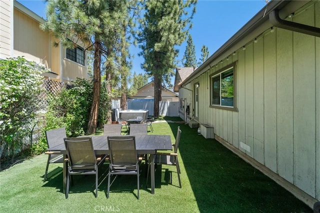 310 Teakwood Dr, Big Bear Lake, CA 92315 - fenced backyard featuring a hot tub and outdoor dining area