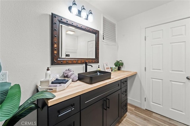 310 Teakwood Dr, Big Bear Lake, CA 92315 - bathroom with wood finished floors and vanity