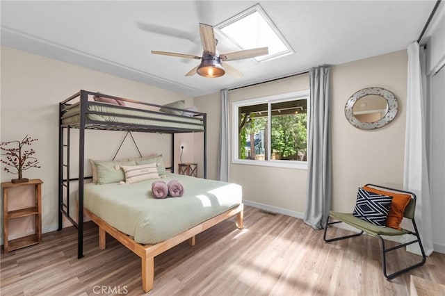 310 Teakwood Dr, Big Bear Lake, CA 92315 - bedroom featuring light wood-style floors, a skylight, and ceiling fan