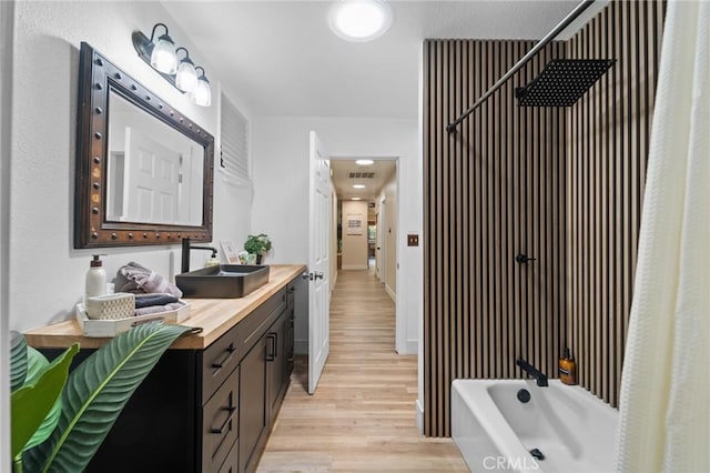 310 Teakwood Dr, Big Bear Lake, CA 92315 - bathroom with vanity, wood finished floors, and tub / shower combination
