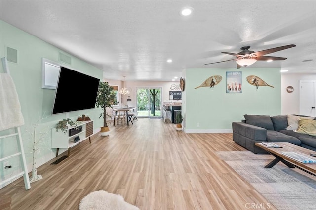 310 Teakwood Dr, Big Bear Lake, CA 92315 - living area with light wood finished floors, a chandelier, ceiling fan, a textured ceiling, and recessed lighting
