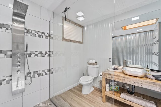 310 Teakwood Dr, Big Bear Lake, CA 92315 - full bathroom with tiled shower and wood finished floors