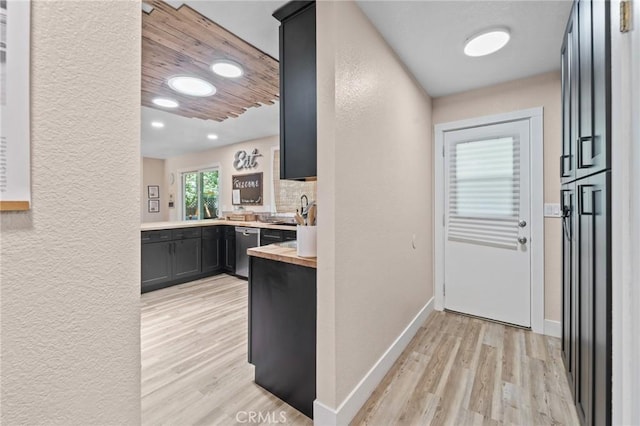 310 Teakwood Dr, Big Bear Lake, CA 92315 - kitchen featuring stainless steel dishwasher, light wood-style floors, a textured wall, recessed lighting, and tasteful backsplash