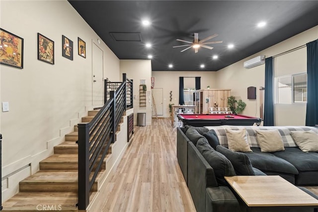 310 Teakwood Dr, Big Bear Lake, CA 92315 - living area with billiards, stairs, a wall mounted AC, light wood-style floors, and a ceiling fan