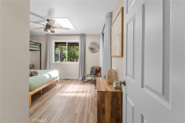 310 Teakwood Dr, Big Bear Lake, CA 92315 - bedroom featuring light wood-style flooring, a skylight, and ceiling fan