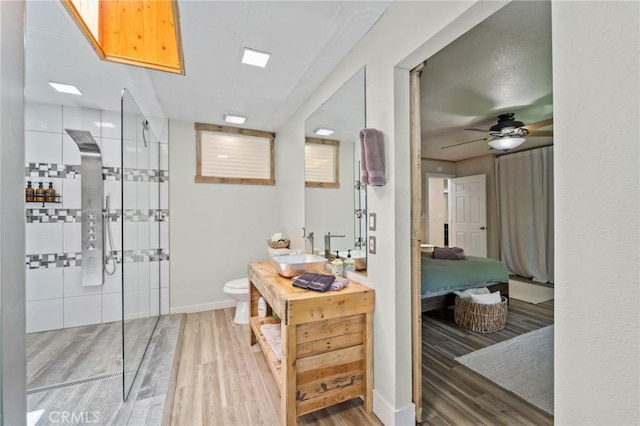 310 Teakwood Dr, Big Bear Lake, CA 92315 - ensuite bathroom with wood finished floors, vanity, tiled shower, and ceiling fan