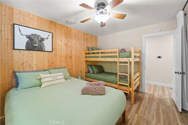 310 Teakwood Dr, Big Bear Lake, CA 92315 - bedroom with wooden walls, wood finished floors, and ceiling fan