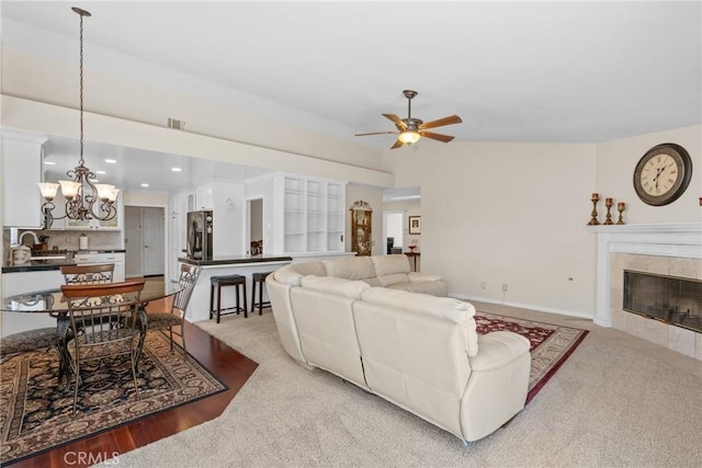 4817 Claybrook Ct, Santa Maria, CA 93455 - carpeted living area with ceiling fan, a chandelier, a fireplace, and recessed lighting