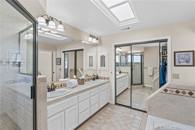 4817 Claybrook Ct, Santa Maria, CA 93455 - full bathroom featuring tile patterned flooring, double vanity, a stall shower, a walk in closet, and a bath
