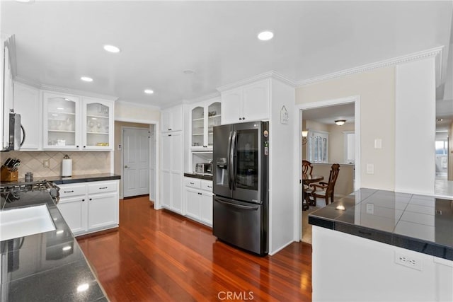 4817 Claybrook Ct, Santa Maria, CA 93455 - kitchen with appliances with stainless steel finishes, dark countertops, dark wood-style floors, white cabinetry, and glass insert cabinets
