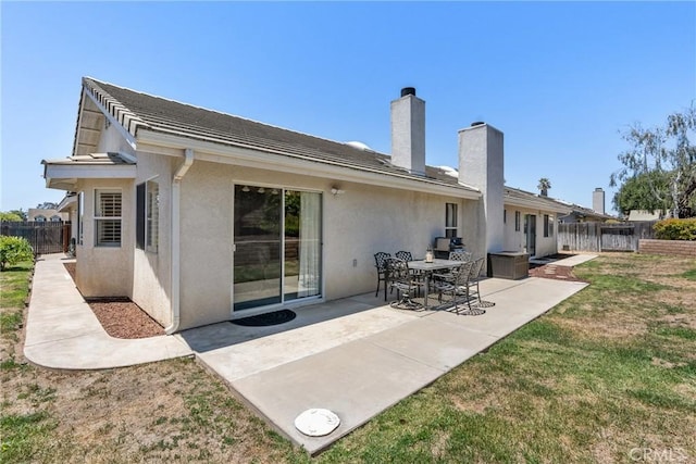 4817 Claybrook Ct, Santa Maria, CA 93455 - back of house featuring stucco siding, a patio area, and a chimney