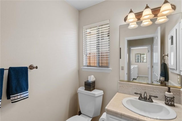 4817 Claybrook Ct, Santa Maria, CA 93455 - half bath with vanity, separate washer and dryer, plenty of natural light, and a chandelier