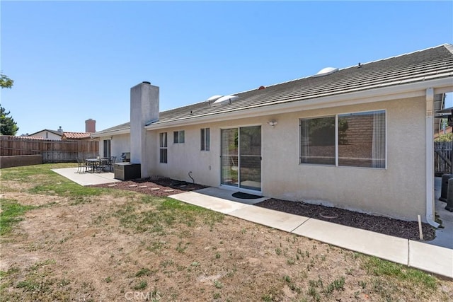 4817 Claybrook Ct, Santa Maria, CA 93455 - back of house with a patio, stucco siding, a chimney, and a tile roof