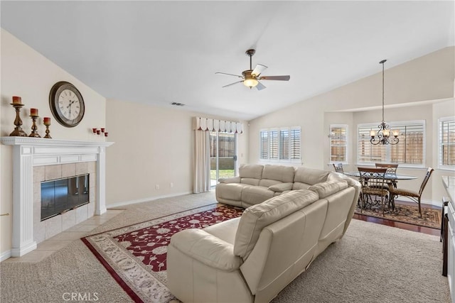 4817 Claybrook Ct, Santa Maria, CA 93455 - living room with light colored carpet, lofted ceiling, a ceiling fan, a chandelier, and a tile fireplace