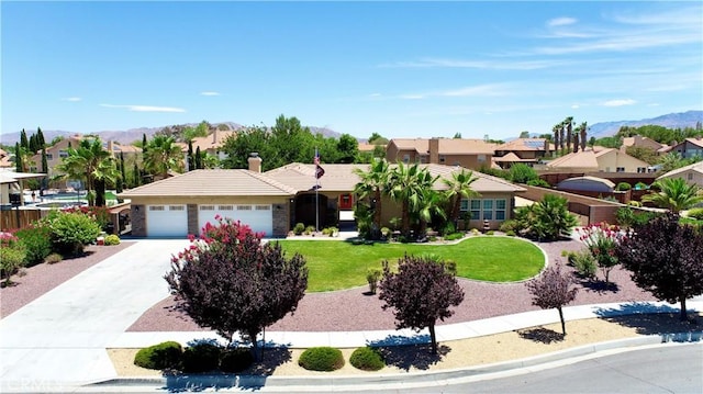 12443 Bannock Dr, Apple Valley, CA 92308 - single story home with a garage, a front lawn, a mountain view, and a tiled roof