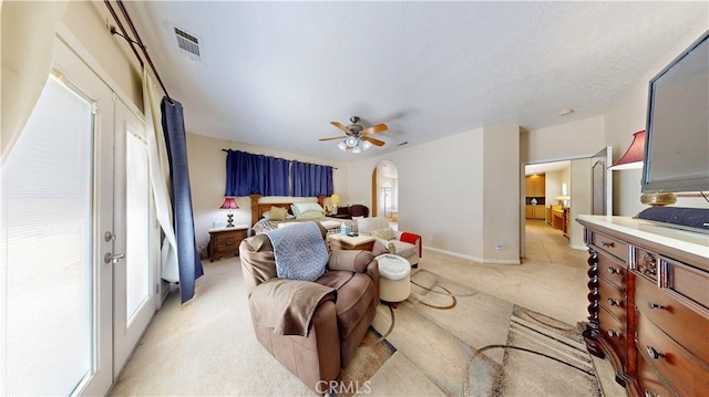 12443 Bannock Dr, Apple Valley, CA 92308 - bedroom featuring light colored carpet, arched walkways, and ceiling fan