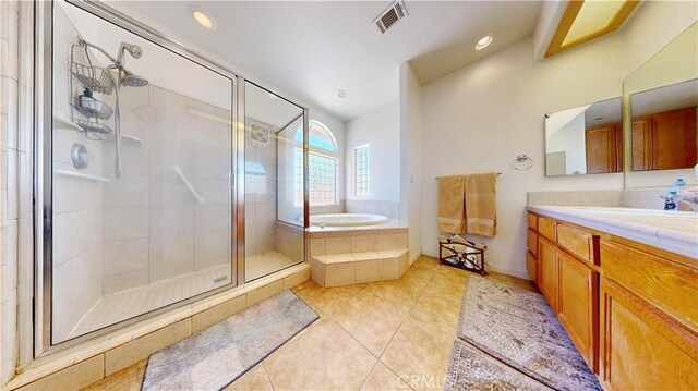 12443 Bannock Dr, Apple Valley, CA 92308 - bathroom featuring vanity, a stall shower, tile patterned floors, a garden tub, and recessed lighting