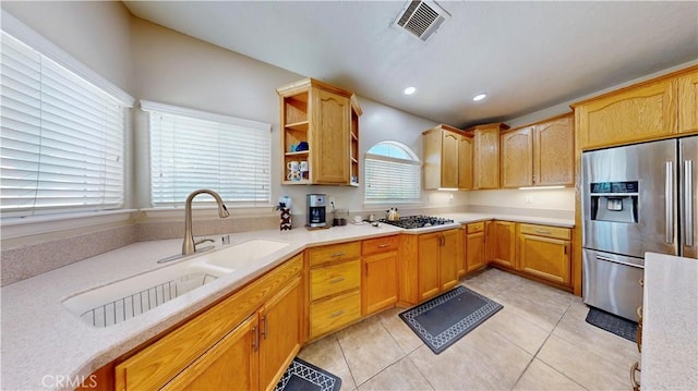 12443 Bannock Dr, Apple Valley, CA 92308 - kitchen featuring stainless steel fridge with ice dispenser, black gas cooktop, light countertops, light tile patterned floors, and open shelves